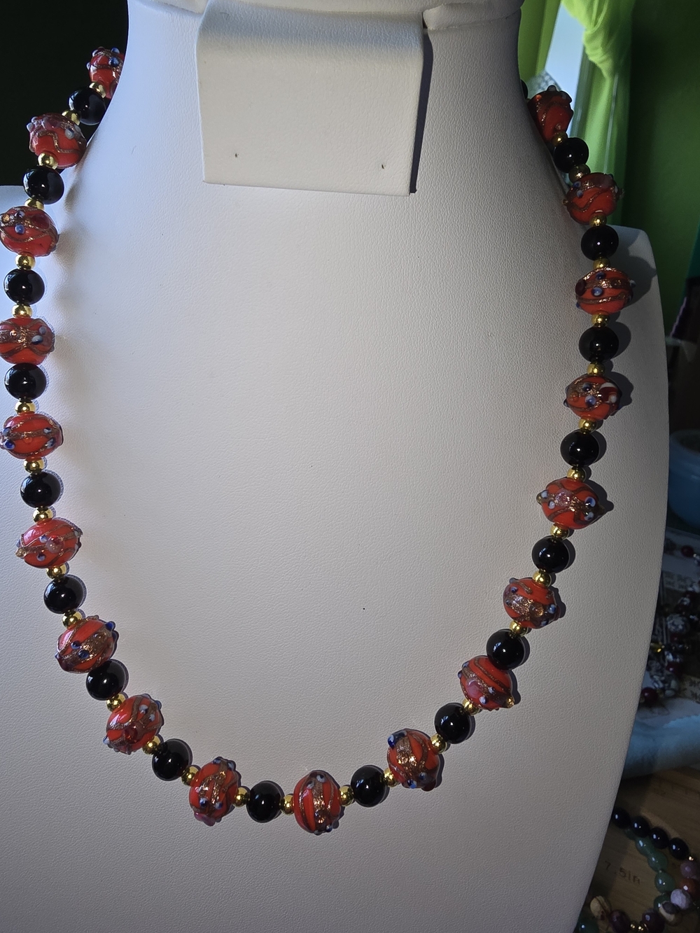 Handcrafted Orange and Black Glass Bead Necklace with Gold Accents